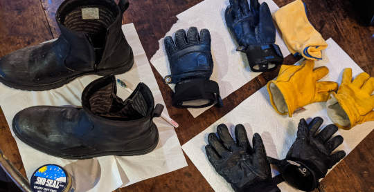 Gloves and boots on table