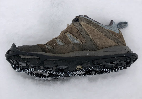 Woman's hiking shoe with attached cleat
